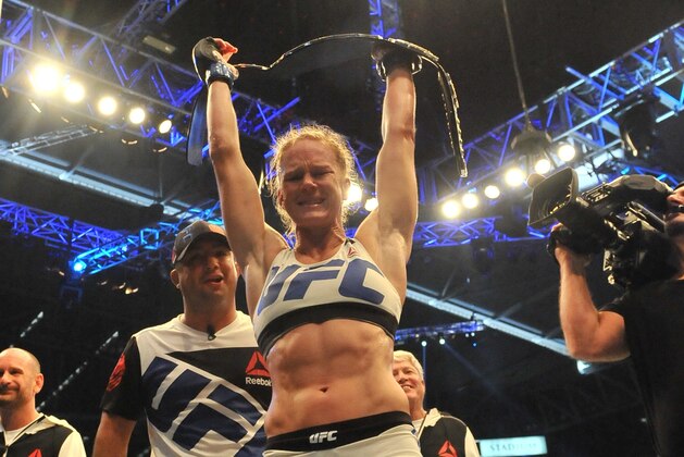 Holly Holm of the US celebrates after winning the UFC title fight against compatriot Ronda Rousey in Melbourne on November 15, 2015. RESTRICTED TO EDITORIAL USE NO ADVERTISING USE NO PROMOTIONAL USE NO MERCHANDISING USE. AFP PHOTO/Paul CROCK (Photo credit should read PAUL CROCK/AFP/Getty Images) Holly Holm of the US celebrates after winning the UFC title fight against compatriot Ronda Rousey in Melbourne on November 15, 2015. RESTRICTED TO EDITORIAL USE NO ADVERTISING USE NO PROMOTIONAL USE NO MERCHANDISING USE. AFP PHOTO/Paul CROCK (Photo credit should read PAUL CROCK/AFP/Getty Images)