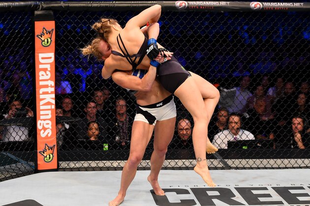 MELBOURNE, AUSTRALIA - NOVEMBER 15:  (L-R) Holly Holm throws Ronda Rousey in their UFC women's bantamweight championship bout during the UFC 193 event at Etihad Stadium on November 15, 2015 in Melbourne, Australia.  (Photo by Josh Hedges/Zuffa LLC/Zuffa LLC via Getty Images)