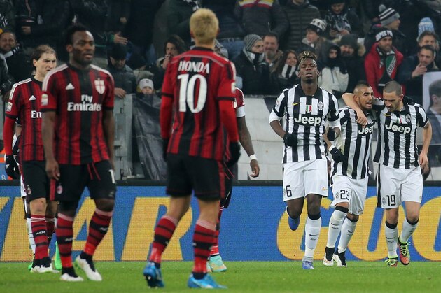 Juventus' defender Leonardo Bonucci (R) celebrates after scoring with his teammates on February 7, 2015 during an Italian Serie A football match Juventus vs. AC Milan at the Juventus Stadium in Turin.  AFP PHOTO / MARCO BERTORELLO        (Photo credit should read MARCO BERTORELLO/AFP/Getty Images)