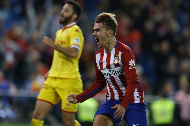 Atletico Madrid's Antoine Griezmann celebrates after scoring the opening goal against Sporting during the Spanish La Liga soccer match between Atletico Madrid and Sporting Gijon at the Vicente Calderon stadium in Madrid, Sunday, Nov. 8, 2015. Griezmann scored the winning goal in Atletico's 1-0 victory. (AP Photo/Francisco Seco)