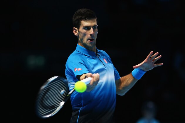 LONDON, ENGLAND - NOVEMBER 15: Novak Djokovic of Serbia plays a forehand in his men's singles match against Kei Nishikori of Japan during day one of the Barclays ATP World Tour Finals at O2 Arena on November 15, 2015 in London, England.  (Photo by Clive Brunskill/Getty Images)