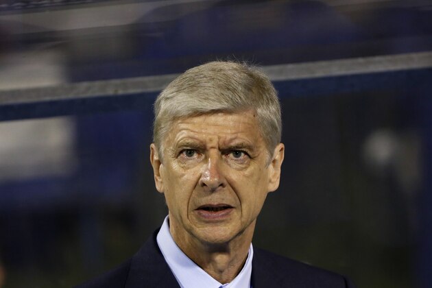 Arsenal's manager Arsene Wenger looks out from the bench during a Champions League Group F soccer match between Dinamo Zagreb and Arsenal at the Maksimir Stadium in Zagreb, Croatia, Wednesday Sept. 16, 2015. (AP Photo/Darko Bandic)