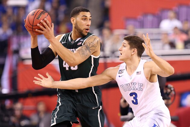 INDIANAPOLIS, IN - APRIL 04: Denzel Valentine #45 of the Michigan State Spartans handles the ball against Grayson Allen #3 of the Duke Blue Devils in the first half during the NCAA Men's Final Four Semifinal at Lucas Oil Stadium on April 4, 2015 in Indianapolis, Indiana.  (Photo by Streeter Lecka/Getty Images)