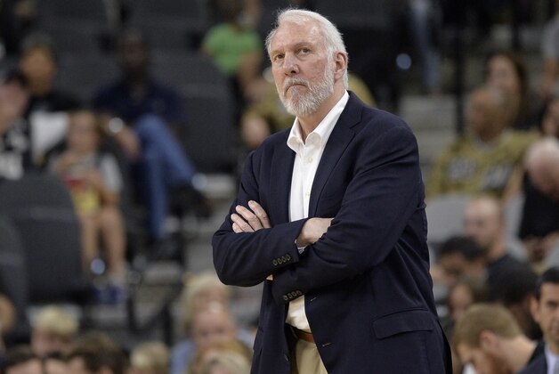 San Antonio Spurs head coach Gregg Popovich watches play during the first half of a preseason NBA basketball game against the Detroit Pistons, Sunday, Oct. 18, 2015, in San Antonio. San Antonio won 96-92. (AP Photo/Darren Abate)