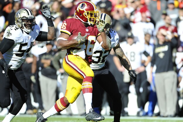 Nov 15, 2015; Landover, MD, USA; Washington Redskins running back Alfred Morris (46) carries the ball as New Orleans Saints strong safety Kenny Vaccaro (32) defends during the first half at FedEx Field. Mandatory Credit: Brad Mills-USA TODAY Sports