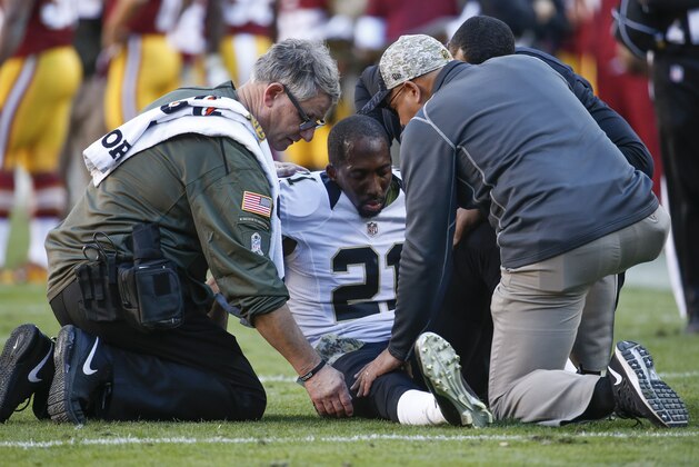 Trainer check New Orleans Saints cornerback Keenan Lewis (21) after an injury during the first half of an NFL football game against the Washington Redskins in Landover, Md., Sunday, Nov. 15, 2015. (AP Photo/Evan Vucci)