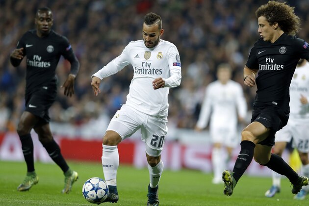 Real Madrid's Jese Rodriguez, left, controls the ball as PSG's David Luiz tries to stop him during the Champions League group A soccer match between Real Madrid and PSG at the Santiago Bernabeu stadium in Madrid, Tuesday, Nov. 3, 2015. (AP Photo/Francisco Seco)