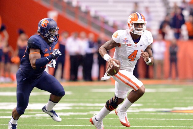 Nov 14, 2015; Syracuse, NY, USA; Clemson Tigers quarterback Deshaun Watson (4) rolls out of the pocket during the first quarter of a game against the Syracuse Orange at the Carrier Dome. Mandatory Credit: Mark Konezny-USA TODAY Sports Nov 14, 2015; Syracuse, NY, USA; Clemson Tigers quarterback Deshaun Watson (4) rolls out of the pocket during the first quarter of a game against the Syracuse Orange at the Carrier Dome. Mandatory Credit: Mark Konezny-USA TODAY Sports