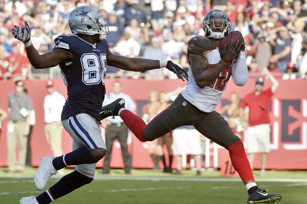 Tampa Bay Buccaneers free safety Bradley McDougald (30) intercepts a pass intended for Dallas Cowboys wide receiver Dez Bryant (88) during the fourth quarter of an NFL football game Sunday, Nov. 15, 2015, in Tampa, Fla. The Buccaneers won the game 10-6. (AP Photo/Phelan M. Ebenhack)