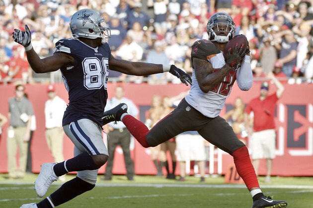 Tampa Bay Buccaneers free safety Bradley McDougald (30) intercepts a pass intended for Dallas Cowboys wide receiver Dez Bryant (88) during the fourth quarter of an NFL football game Sunday, Nov. 15, 2015, in Tampa, Fla. The Buccaneers won the game 10-6. (AP Photo/Phelan M. Ebenhack)