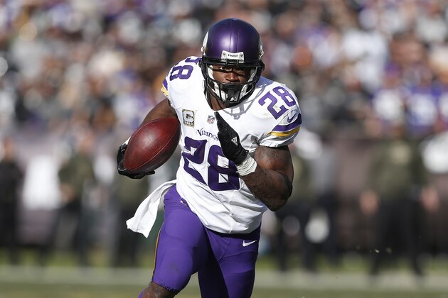 Minnesota Vikings running back Adrian Peterson (28) runs against the Oakland Raiders during the first half of an NFL football game in Oakland, Calif., Sunday, Nov. 15, 2015. (AP Photo/Beck Diefenbach)