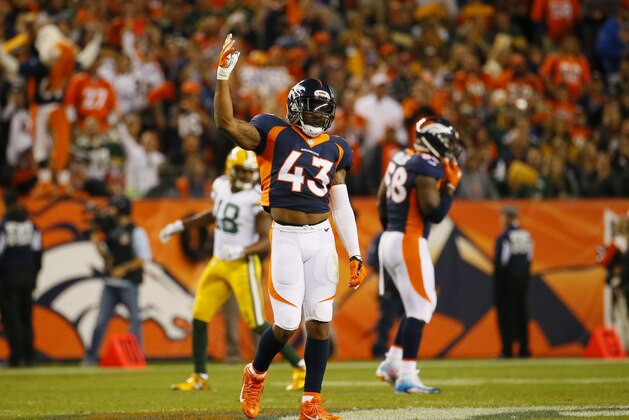 Denver Broncos strong safety T.J. Ward gets the crowd to be loud during an NFL football game between the Denver Broncos and the Green Bay Packers, Sunday, Nov. 1, 2015, in Denver. (AP Photo/Jack Dempsey)