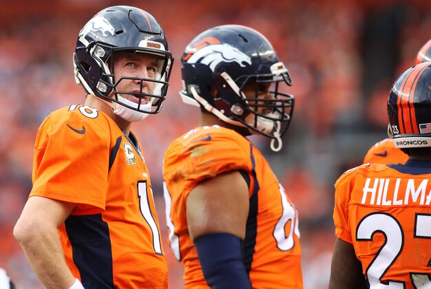 Nov 15, 2015; Denver, CO, USA; Denver Broncos quarterback Peyton Manning (18) looks on during the first half against the Kansas City Chiefs at Sports Authority Field at Mile High. Mandatory Credit: Chris Humphreys-USA TODAY Sports