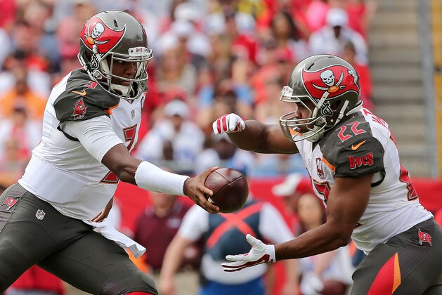 TAMPA, FL - NOVEMBER 15:  Jameis Winston #3 hands off to Doug Martin #22 of the Tampa Bay Buccaneers during a game  at Raymond James Stadium on November 15, 2015 in Tampa, Florida.  (Photo by Mike Ehrmann/Getty Images)