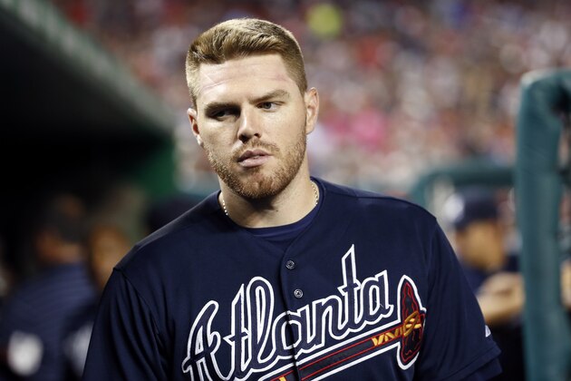 Atlanta Braves first baseman Freddie Freeman (5) walks in the dugout during a baseball game against the Washington Nationals at Nationals Park, Saturday, Sept. 5, 2015, in Washington. (AP Photo/Alex Brandon)