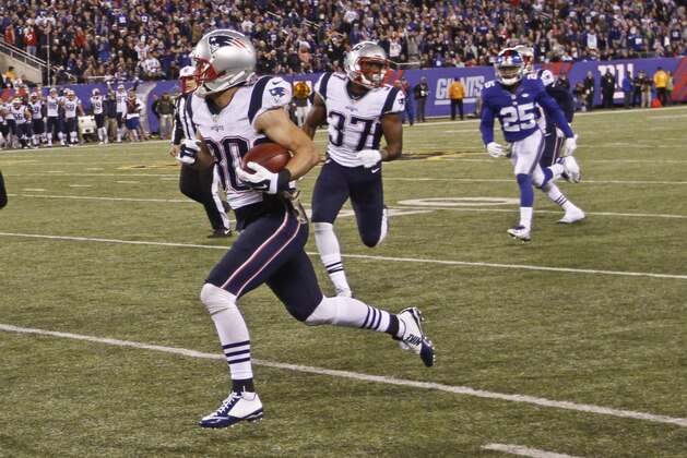 New England Patriots' Danny Amendola (80) runs away from New York Giants' Tramain Jacobs (25) during the second half of an NFL football game Sunday Nov. 15, 2015, in East Rutherford, N.J. (AP Photo/Gary Hershorn)