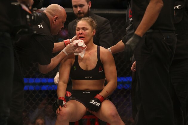 MELBOURNE, AUSTRALIA - NOVEMBER 15:  Ronda Rousey of the United States receives medical treatment after being defeated by Holly Holm of the United States in their UFC women's bantamweight championship bout during the UFC 193 event at Etihad Stadium on November 15, 2015 in Melbourne, Australia.  (Photo by Pat Scala /Zuffa LLC/Zuffa LLC via Getty Images)