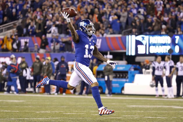 New York Giants wide receiver Odell Beckham (13) celebrates as he runs for a touchdown during the first half of an NFL football game against the New England Patriots, Sunday, Nov. 15, 2015, in East Rutherford, N.J. (AP Photo/Julio Cortez)