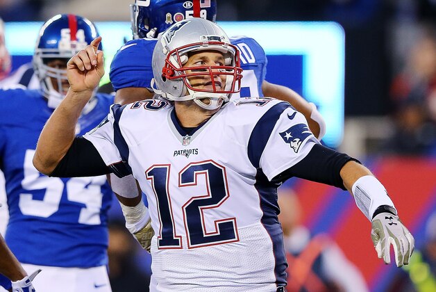 EAST RUTHERFORD, NJ - NOVEMBER 15:  Tom Brady #12 of the New England Patriots celebrates a first down against the New York Giants during the first quarterat MetLife Stadium on November 15, 2015 in East Rutherford, New Jersey.  (Photo by Elsa/Getty Images)