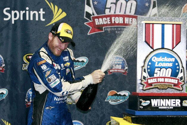 Dale Earnhardt Jr. celebrates after winning the the NASCAR Sprint Cup Series auto race at Phoenix International Raceway, Sunday, Nov. 15, 2015, in Avondale, Ariz. Earnhadrt was leading on lap 219 when the race was called due to rain. (AP Photo/Ralph Freso)