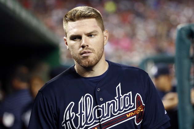 Atlanta Braves first baseman Freddie Freeman (5) walks in the dugout during a baseball game against the Washington Nationals at Nationals Park, Saturday, Sept. 5, 2015, in Washington. (AP Photo/Alex Brandon)