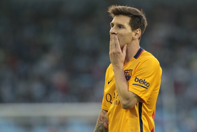 Barcelona's Lionel Messi from Argentina, gestures during a Spanish La Liga soccer match between RC Celta and FC Barcelona, at the Balaídos stadium in Vigo, Spain, Wednesday, Sept. 23, 2015. (AP Photo/Lalo R. Villar)