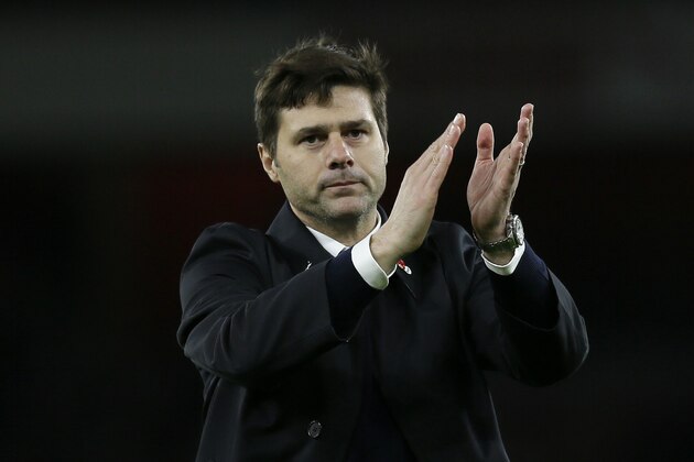 Tottenham manager Mauricio Pochettino applauds the fans after the English Premier League soccer match between Arsenal and Tottenham Hotspur at the Emirates Stadium in London, Sunday Nov. 8, 2015. (AP Photo/Tim Ireland)