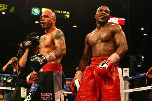 LAS VEGAS, NV - MAY 05:  Miguel Cotto and Floyd Mayweather Jr. react after the end of the 12th round after their WBA super welterweight title fight at the MGM Grand Garden Arena on May 5, 2012 in Las Vegas, Nevada. Mayweather Jr. defeated Cotto by unanimous decision. (Photo by Al Bello/Getty Images)