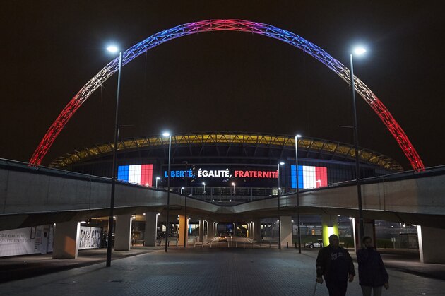 The arch of London's Wembley Stadium is illuminated in blue, white and red lights, resembling the colours of the French national flag, in west London on November 15, 2015, as Britons express their solidarity with France following a spate of coordinated attacks in Paris on November 13 that left more than 120 people dead. Islamic State jihadists claimed a series of coordinated attacks by gunmen and suicide bombers in Paris on November 13 that killed at least 128 people in scenes of carnage at a concert hall, restaurants and the national stadium. AFP PHOTO / NIKLAS HALLE'N (Photo credit should read NIKLAS HALLE'N/AFP/Getty Images) The arch of London's Wembley Stadium is illuminated in blue, white and red lights, resembling the colours of the French national flag, in west London on November 15, 2015, as Britons express their solidarity with France following a spate of coordinated attacks in Paris on November 13 that left more than 120 people dead. Islamic State jihadists claimed a series of coordinated attacks by gunmen and suicide bombers in Paris on November 13 that killed at least 128 people in scenes of carnage at a concert hall, restaurants and the national stadium. AFP PHOTO / NIKLAS HALLE'N (Photo credit should read NIKLAS HALLE'N/AFP/Getty Images)