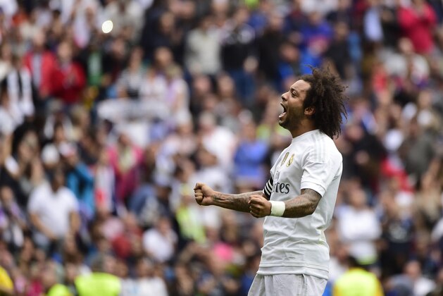 Real Madrid's Brazilian defender Marcelo celebrates a goal during the Spanish league football match Real Madrid CF vs Levante UD at the Santiago Bernabeu stadium in Madrid on October 17, 2015. AFP PHOTO/ PIERRE-PHILIPPE MARCOU        (Photo credit should read PIERRE PHILIPPE MARCOU,PIERRE-PHILIPPE MARCOU/AFP/Getty Images)