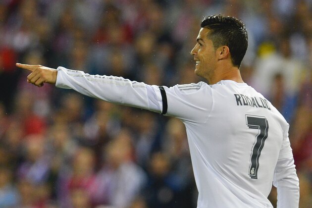Real Madrid's Portuguese forward Cristiano Ronaldo gestures during the Spanish league football match Club Atletico de Madrid vs Real Madrid CF at the Vicente Calderon stadium in Madrid on October 4, 2015.   AFP PHOTO/ CURTO DE LA TORRE        (Photo credit should read CURTO DE LA TORRE/AFP/Getty Images)