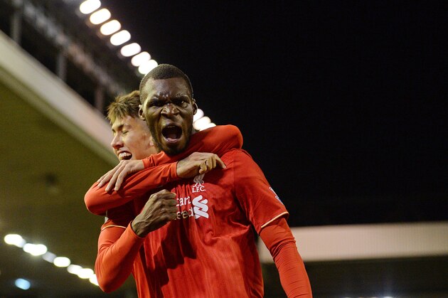 Liverpool's Zaire-born Belgian striker Christian Benteke (R) celebrates with Liverpool's Brazilian midfielder Roberto Firmino after scoring the opening goal of the English Premier League football match between Liverpool and Southampton at Anfield stadium in Liverpool, north west England on October 25, 2015. The game finished 1-1. AFP PHOTO / OLI SCARFF

RESTRICTED TO EDITORIAL USE. No use with unauthorized audio, video, data, fixture lists, club/league logos or 'live' services. Online in-match use limited to 75 images, no video emulation. No use in betting, games or single club/league/player publications.        (Photo credit should read OLI SCARFF/AFP/Getty Images)