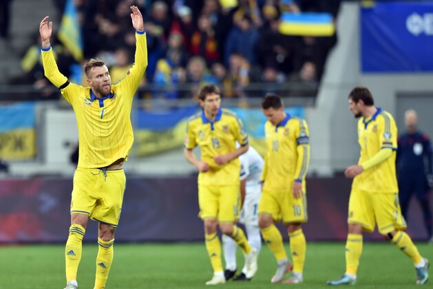 Ukraine's Andriy Yarmolenko (L) celebrates after scoring against Slovenia in the Euro 2016 play-off football match between Ukraine and Slovenia at the Arena Lviv stadium in Lviv on November 14, 2015.   AFP PHOTO/ SERGEI SUPINSKY        (Photo credit should read SERGEI SUPINSKY/AFP/Getty Images)