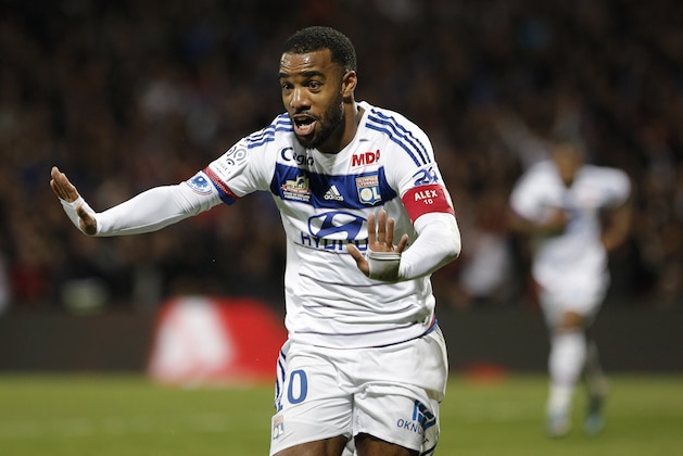 Lyon's Alexandre Lacazette celebrates after scoring a goal against Saint-Etienne during their French League One soccer match at Gerland stadium, in Lyon, central France, Sunday, Nov. 8, 2015. (AP Photo/Laurent Cipriani)