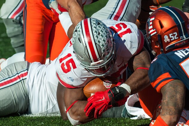 Ohio State running back Ezekiel Elliott (15) dives in the end zone for a touchdown during the third quarter of an NCAA college football game against Illinois Saturday, Nov. 14, 2015 at Memorial Stadium in Champaign, Ill.  Ohio State won 28-3.  (AP Photo/Bradley Leeb)