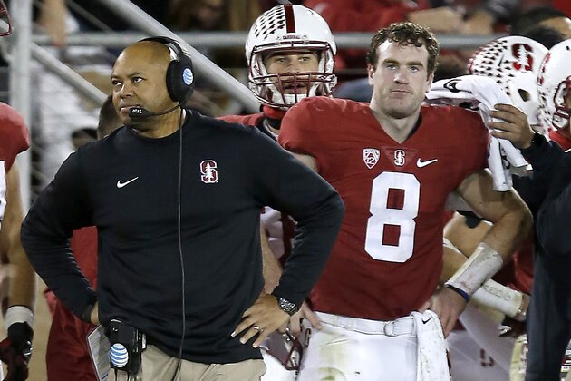 Stanford quarterback Kevin Hogan (8) and head coach David Shaw, left, watches from the sidelines against Oregon during the second half of an NCAA college football game Saturday, Nov. 14, 2015, in Stanford, Calif. Oregon won 38-36. (AP Photo/Tony Avelar)