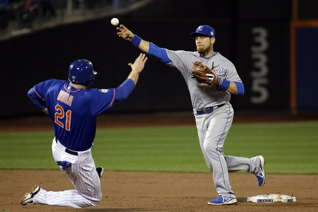 New York Mets' Lucas Duda is out at first as Kansas City Royals' Ben Zobrist throws to first to turn a double play on a ball hit by Travis d'Arnaud during the second inning of Game 5 of the Major League Baseball World Series Sunday, Nov. 1, 2015, in New York. (AP Photo/David J. Phillip)