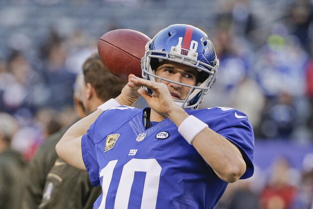 New York Giants quarterback Eli Manning (10) throws a pass before an NFL football game against the New England Patriots Sunday Nov. 15, 2015, in East Rutherford, N.J. (AP Photo/Julie Jacobson)