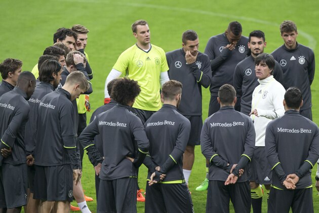 Germany's head coach Joachim Loew, right, speaks to his soccer team during practice at the Stade de France stadium in Saint Denis, France, outside Paris, Thursday, Nov. 12, 2015. Germany will face France in a friendly soccer match on Friday. (AP Photo/Michel Euler)