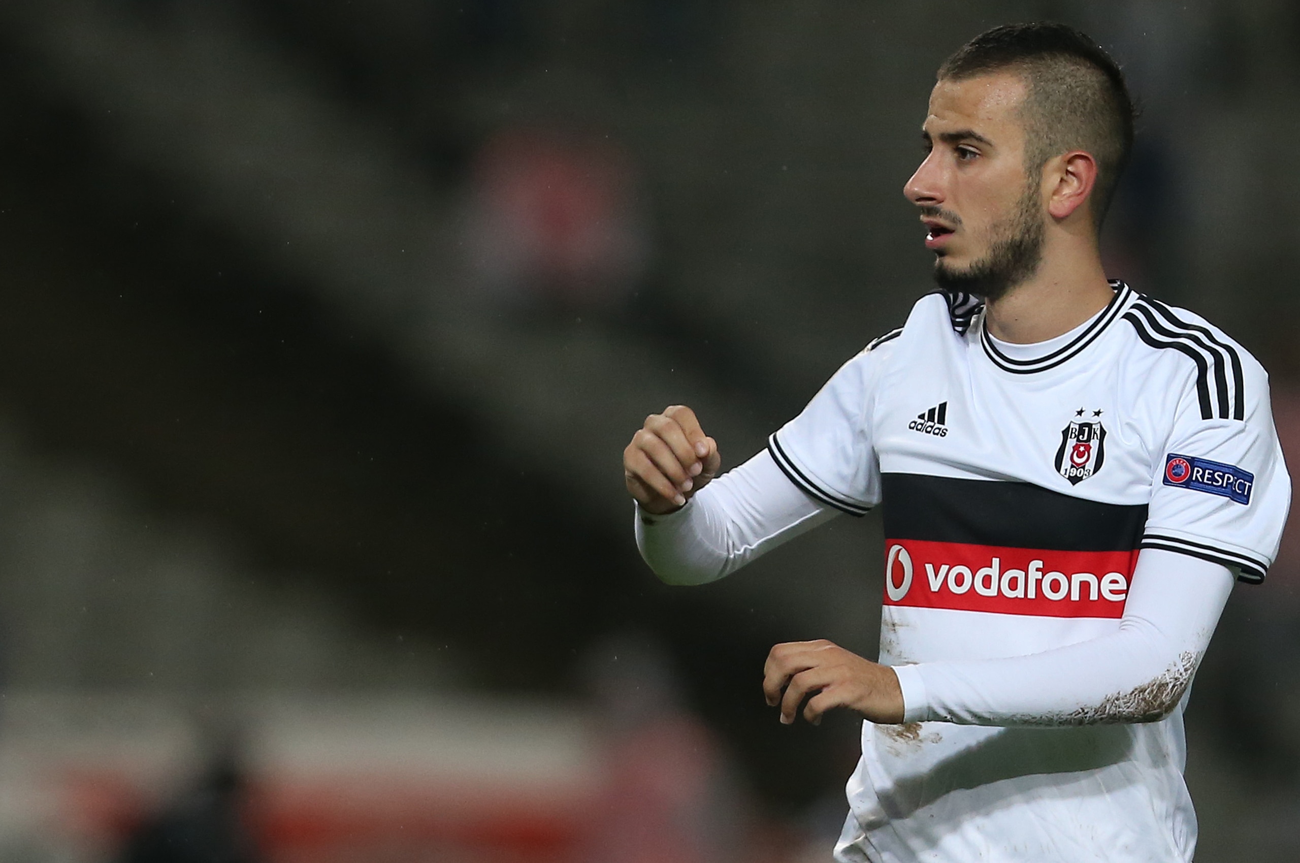 ISTANBUL, TURKEY -  SEPTEMBER 18: Oguzhan Ozyakup of Besiktas in action during the UEFA Europa League Group C match between Besiktas JK and Asteras Tripolis FC at the Ataturk Olympic Stadium in Istanbul, on September 18, 2014 in Istanbul,Turkey. (Photo by Burak Kara/Getty Images)