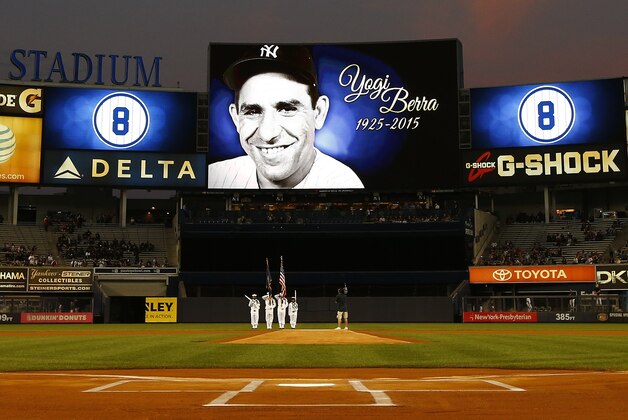 NEW YORK, NY - SEPTEMBER 24: A U.S. Navy color guard displays the flag during a moment of silence for Yogi Berra before a MLB baseball game between the Chicago White Sox and New York Yankees at Yankee Stadium on September 24, 2015 in the Bronx borough of New York City. The Yankee legend passed away on Tuesday night at the age of 90.  (Photo by Rich Schultz/Getty Images)