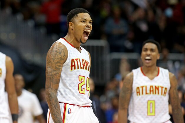Nov 7, 2015; Atlanta, GA, USA; Atlanta Hawks guard Kent Bazemore (24) celebrates after his three-point basket in the fourth quarter of their game against the Washington Wizards at Philips Arena. Also shown on the play is Atlanta Hawks guard Jeff Teague (0). The Hawks won 114-99. Mandatory Credit: Jason Getz-USA TODAY Sports
