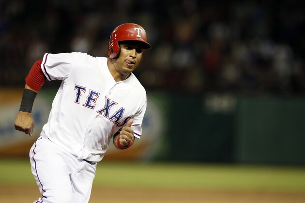 Texas Rangers' Leonys Martin sprints home scoring on a Josh Hamilton single in the ninth inning of a baseball game Thursday, July 30, 2015, in Arlington, Texas. (AP Photo/Tony Gutierrez)