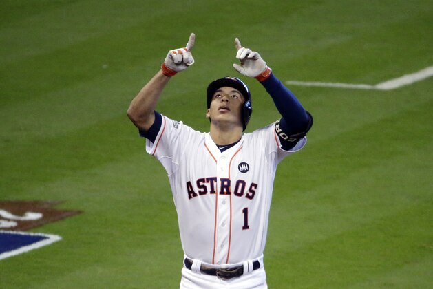 Houston Astros' Carlos Correa (1) celebrates his solo home run against the Kansas City Royals in the third inning during Game 4 of baseball's American League Division Series, Monday, Oct. 12, 2015, in Houston. (AP Photo/Patric Schneider)