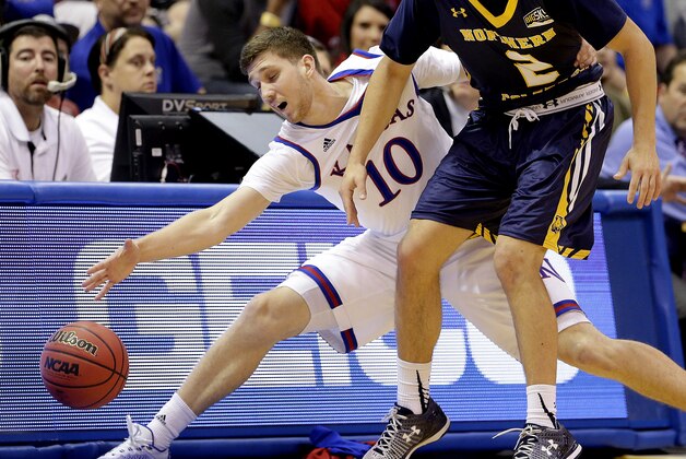 Kansas' Sviatoslav Mykhailiuk (10) steals the ball away from Northern Colorado's Cameron Michael during the first half of an NCAA college basketball game Friday, Nov. 13, 2015, in Lawrence, Kan. (AP Photo/Charlie Riedel)