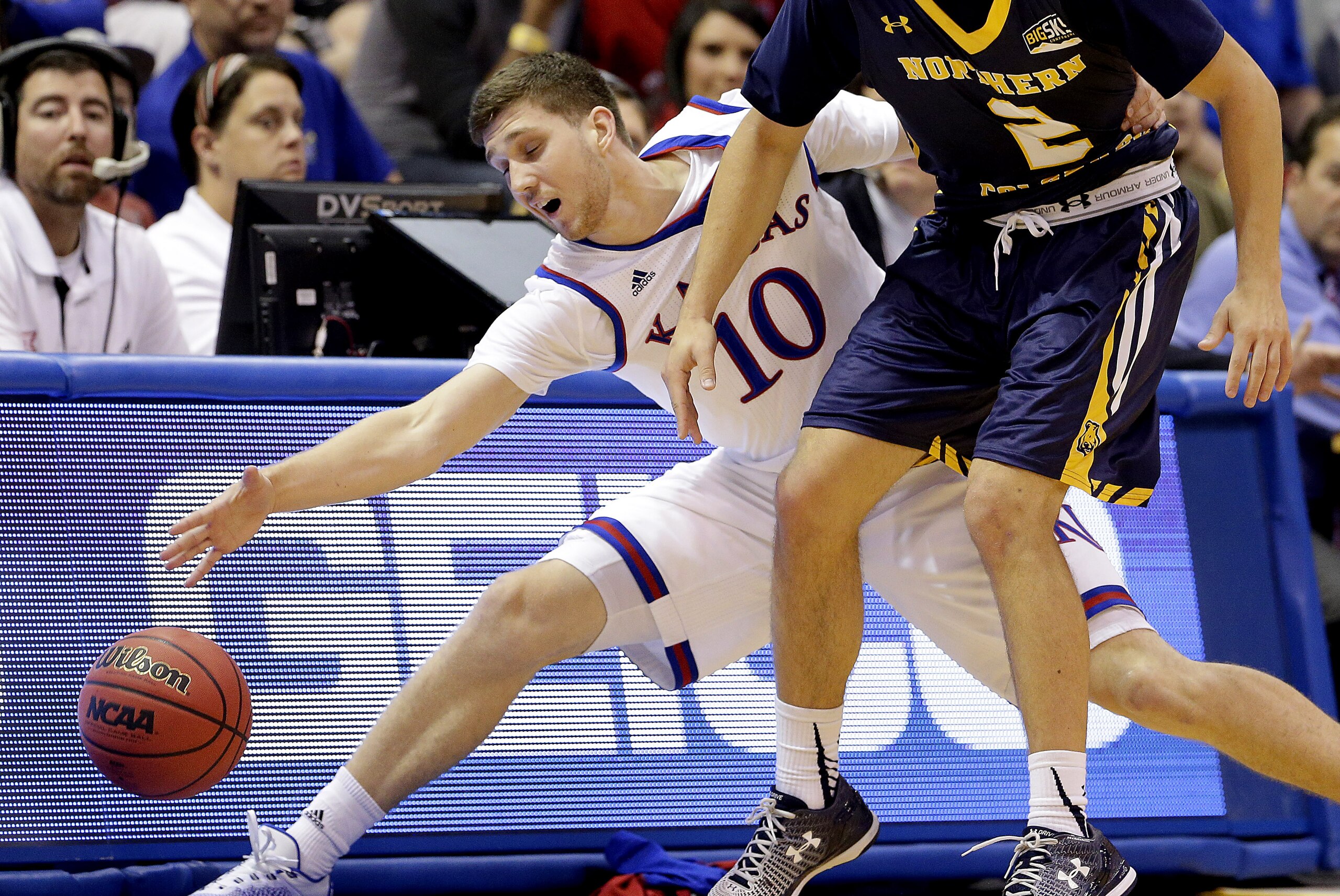 Kansas' Sviatoslav Mykhailiuk (10) steals the ball away from Northern Colorado's Cameron Michael during the first half of an NCAA college basketball game Friday, Nov. 13, 2015, in Lawrence, Kan. (AP Photo/Charlie Riedel)