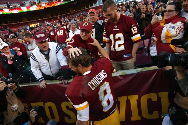LANDOVER, MD - NOVEMBER 15: Quarterback Kirk Cousins #8 of the Washington Redskins celebrates with fans after the Washington Redskins defeated the New Orleans Saints 47-14 during a game at FedExField on November 15, 2015 in Landover, Maryland. (Photo by Matt Hazlett/Getty Images)