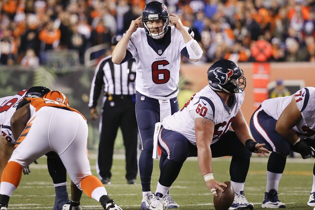 Houston Texans quarterback T.J. Yates (6) signals to his players at the line of scrimmage in the second half of an NFL football game against the Cincinnati Bengals in Cincinnati, Monday, Nov. 16, 2015.  (AP Photo/Frank Victores)