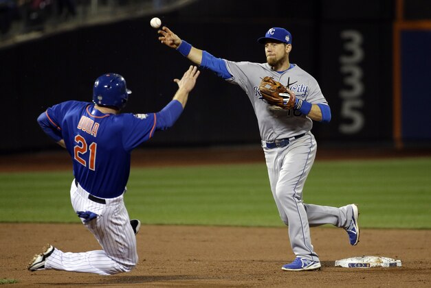 New York Mets' Lucas Duda is out at first as Kansas City Royals' Ben Zobrist throws to first to turn a double play on a ball hit by Travis d'Arnaud during the second inning of Game 5 of the Major League Baseball World Series Sunday, Nov. 1, 2015, in New York. (AP Photo/David J. Phillip)