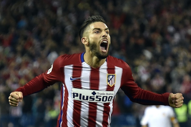 Atletico Madrid's Belgian midfielder Yannick Ferreira Carrasco celebrates a goal during the Spanish league football match Club Atletico de Madrid vs Valencia CF at the Vicente Calderon stadium in Madrid on October 25, 2015.   AFP PHOTO/ GERARD JULIEN        (Photo credit should read GERARD JULIEN/AFP/Getty Images)
